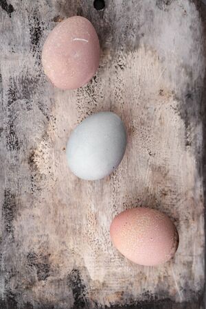 Setting Easter table with colored eggsの写真素材