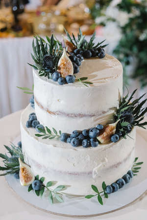 Tiered wedding cake decorated with decorの写真素材