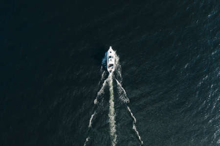 View from the drone from above the boat sails on the Teletskoye lakeの写真素材