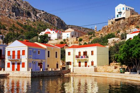 Traditional houses by the harbour of the town of Kastelorizo, Kastelorizo island, Dodecanese islands, Greeceの写真素材
