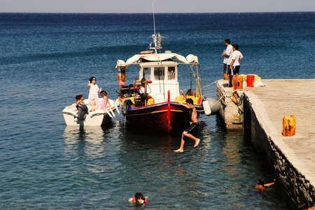 Greece, Karpathos island, people having refreshment time at the port of Diafani, August 16 2008.