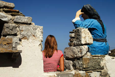 Greece, Karpathos island, statue of woman dressed with traditional costume at the port of Diafani, August 16 2008.のeditorial素材