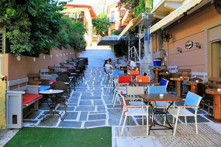 Greece, Athens, June 16 2020 - View of one of the most touristic spots of Plaka district with a cafe-restaurant almost empty. Tourism has been the worst affected of all major economic sectors by the coronavirus (COVID-19).のeditorial素材