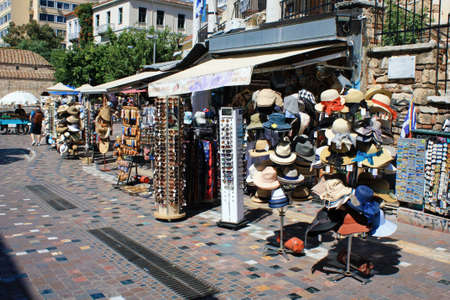 Greece, Athens, June 17 2020 - Hats stacked on stands outside store at Monastiraki square.の写真素材