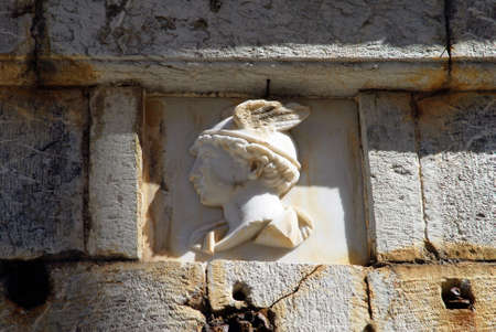 Greece, Symi island, the head of the Greek god Hermes carved on stone in the town of Symi, September...