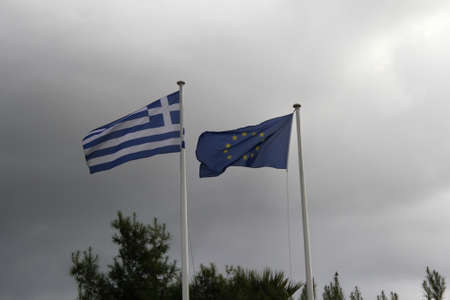 The national flag of Greece and flag of European Union waving - Athens, Greece, February 5 2020.