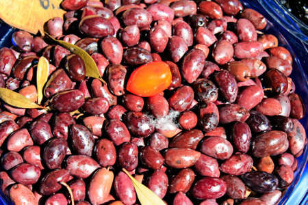 Stall with Greek Kalamon or Kalamata olives at street market.