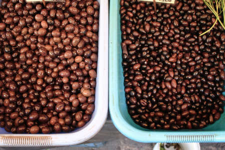 Stall with olives at street market in Athens, Greece, October 9 2020.