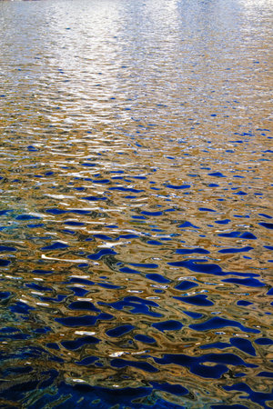 Reflection of the sun on the water surface. Abstract background.