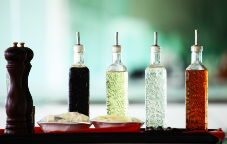 Oil bottles   peppers grinders in restaurant