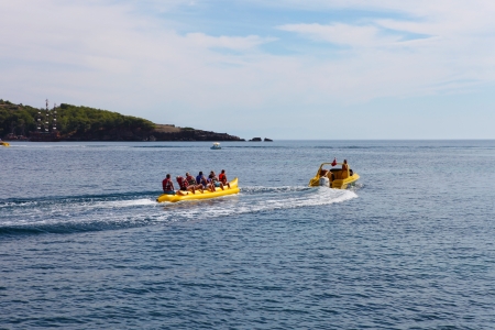 Banana boat in sea. Group of riding banana boatのeditorial素材