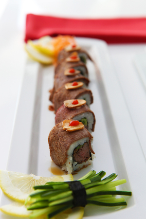 Colorful sushi on the plate in restaurantの写真素材