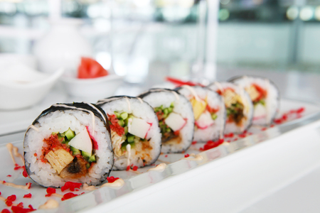 Colorful sushi on the plate in restaurantの写真素材