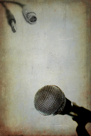 Grunge music background with vintage dynamic microphoneの写真素材