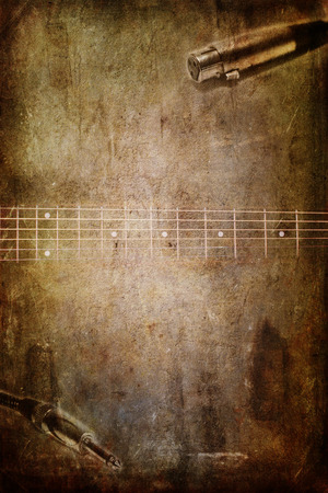 Musical vintage background with guitar and mic cable jackの写真素材