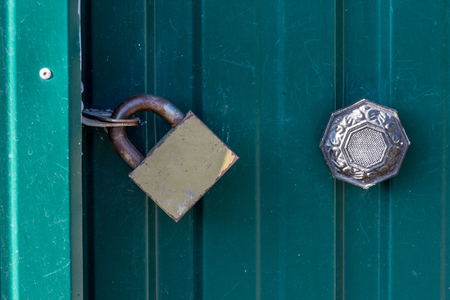 Padlocks are portable locks with a shackle that can be passed through an opening (such as a chain link, or hasp staple) to prevent use, theft, vandalism or harm.の写真素材