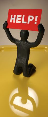 The Plasticine man and red plate on yellow backgroundの写真素材