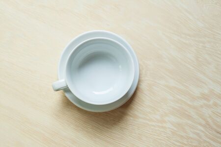 Empty coffee cup on wood backgroundの写真素材