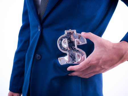 Young businessman Hold a financial 
symbol in a suit pocket.の写真素材