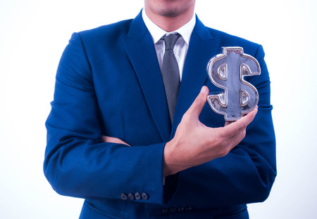 Young businessman Hold a financial symbolの写真素材