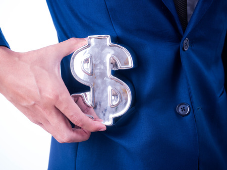 Young businessman Hold a financial 
symbol in a suit pocket.の写真素材