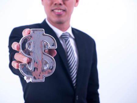 Young businessman hold a financial 
symbol isolated on white background.の写真素材
