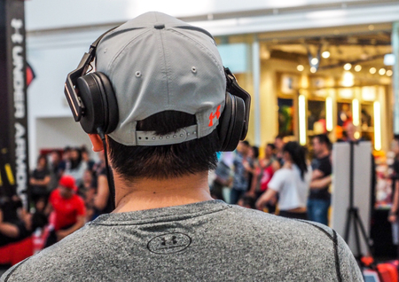 BANGKOK THAILAND, April 4, 2017: Dj Man listening to music with headphonesのeditorial素材