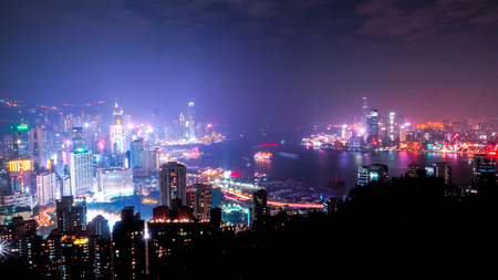 HONG KONG, CHINA - DECEMBER 10, 2016: Skyscrapers and other buildings on Hong Kong Island in Hong Kong, China, viewed from the Braemar Hill on a foggy and cloudy night.のeditorial素材