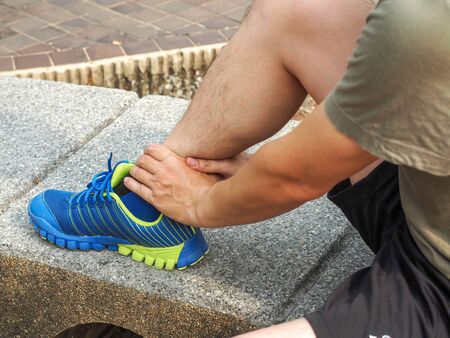 ankle injury, man runner ankle painの写真素材