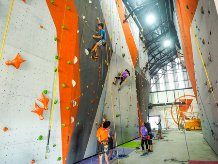 climb central bangkok Thailand : Attractive of many people climbing up the wall in gymの写真素材