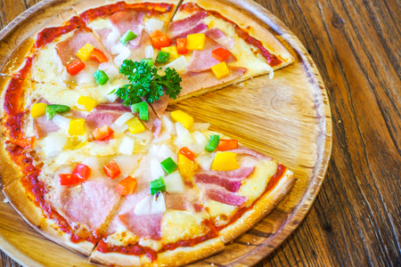 Pizza on the wooden background.の写真素材
