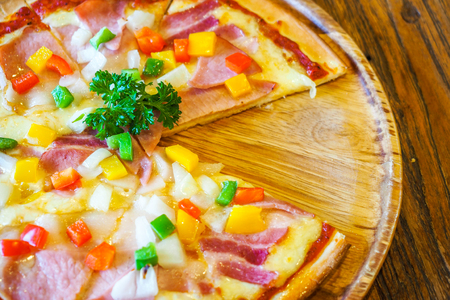 Pizza on the wooden background.の写真素材