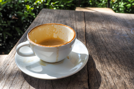 empty cup of hot coffee with coffee mark in the white coffee cup on the saucer with coffeeの写真素材