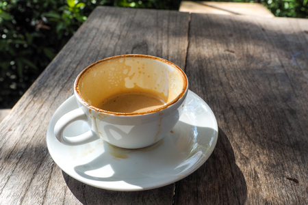 empty cup of hot coffee with coffee mark in the white coffee cup on the saucer with coffeeの写真素材