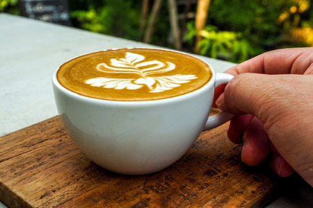 Human Hand Holding Coffee Cup Morning Drinksの写真素材