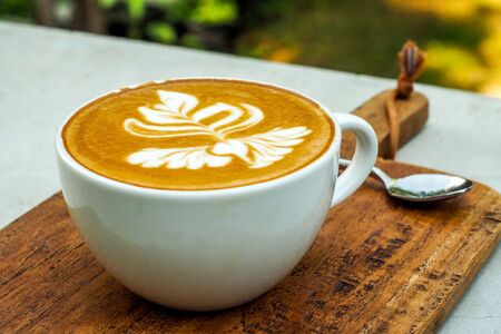 Coffee cup on a wooden table.の写真素材
