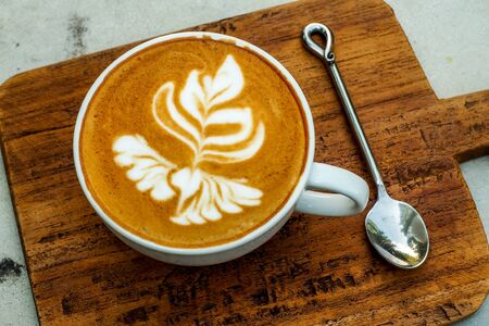 Coffee cup on a wooden table.の写真素材
