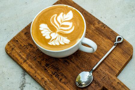 Coffee cup on a wooden table.の写真素材