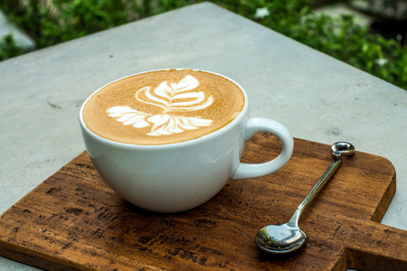 Coffee cup on a wooden table.の写真素材
