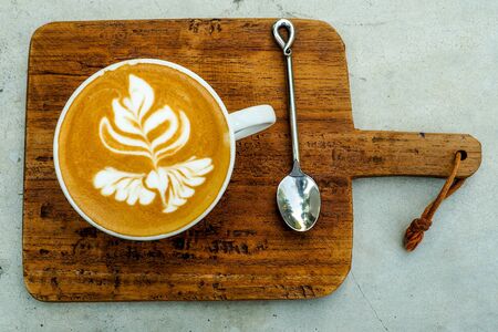 Coffee cup on a wooden table.の写真素材