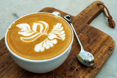 Coffee cup on a wooden table.の写真素材