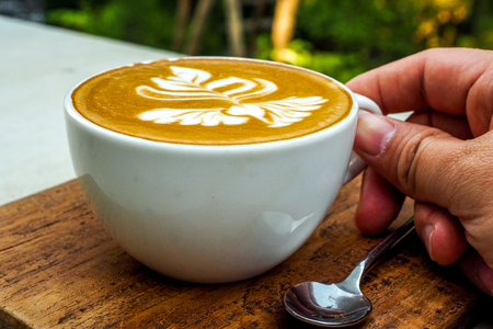 Human Hand Holding Coffee Cup Morning Drinksの写真素材