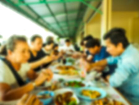Blurred image of  Family holiday, sit and eat togetherの写真素材