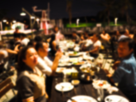 Blurred image of  Family holiday, sit and eat togetherの写真素材
