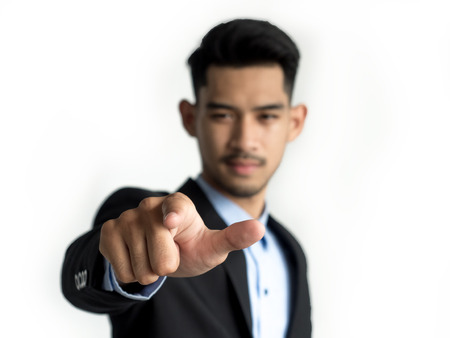 Close-up of a businessman Pointing to the front isolated on a white background