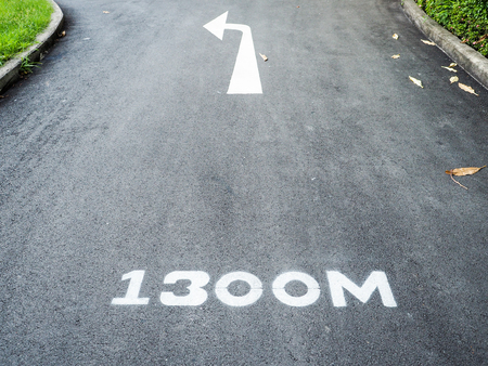 Left turn arrow signals a marked run path 1,300 meters.の写真素材