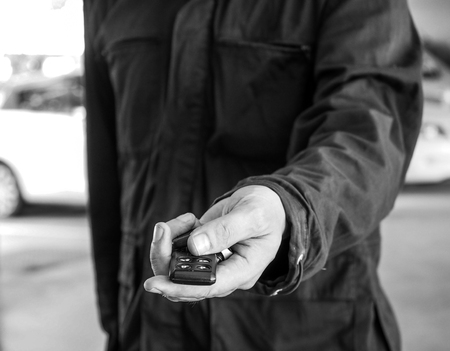 man handing a car keyの写真素材