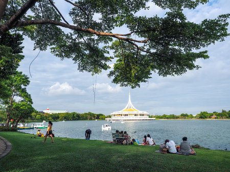 People sitting and relaxing by the lakeのeditorial素材