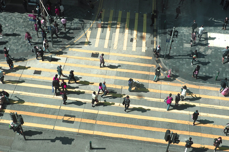 HONGKONG, CHINA - December 8 2016: Unidentified pedestrians on zebra crossing street on December 8, 2016 in Hongkong, China.のeditorial素材