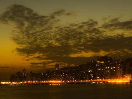 City of Hong Kong with water front with sunrise sky background